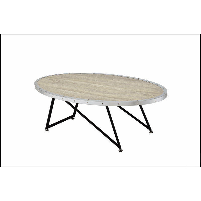Table basse en chêne vieilli et en métal, idéale pour ajouter une touche rustique et une élégance moderne à votre salon.