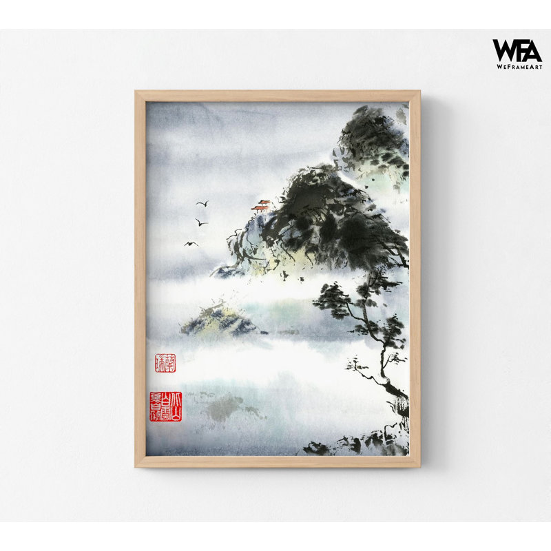 Framed ink wash landscape painting of Asian mountains in a light wood frame.