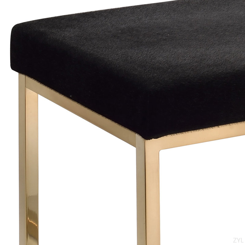 Repose-pieds en tissu noir et finition champagne