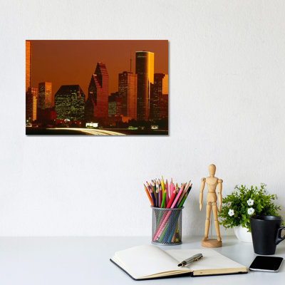 Skyscrapers In A City At Sunset - Wrapped Canvas Print
