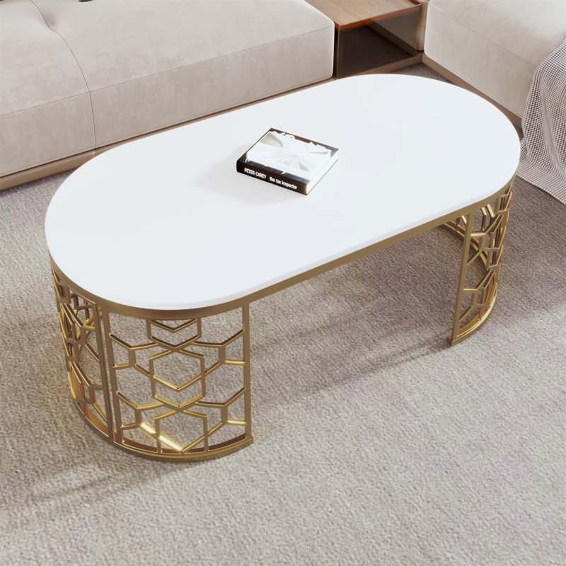 Table basse moderne ovale avec structure en acier inoxydable