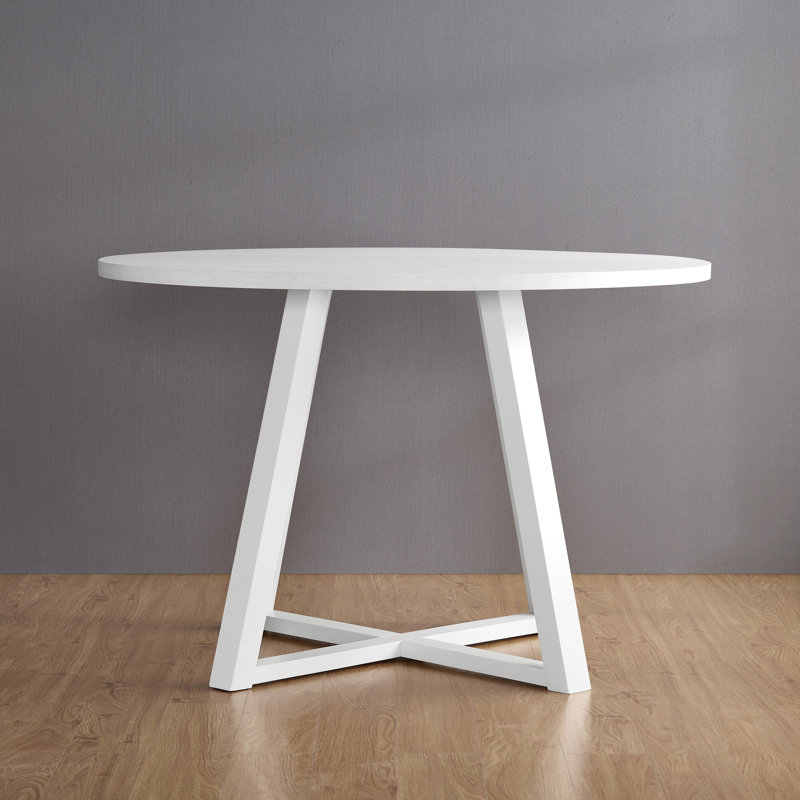 Table de salle à manger contemporaine avec plateau rond en blanc et base élégante en tréteaux