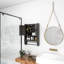 Armoire de salle de bain grise avec tablettes réglables et porte-serviettes de rangement efficace au-dessus de la toilette