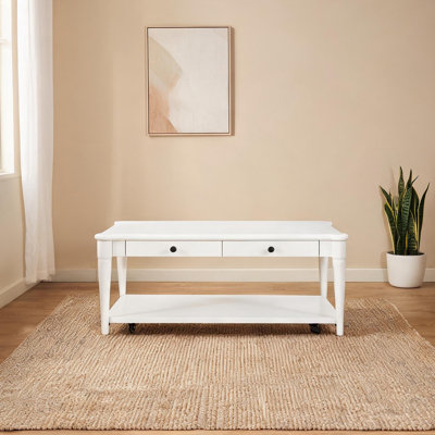 Table basse traditionnelle avec deux tiroirs de rangement et roulettes en bois massif blanc