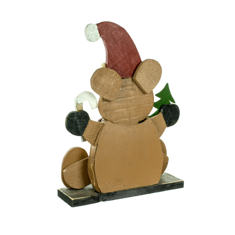 Teddy de noël assis avec chapeau de noël assis