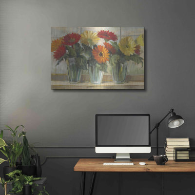 "Gerberas dans des vases en verre" par Carol Rowan