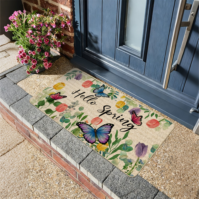 Tapis de porte « Bonjour Printemps » à motifs de papillons et de tulipes, décoratif pour l'extérieur, antidérapant, avec dos en caoutchouc. Parfait pour l'entrée, l'intérieur et la cuisine. 43 x 74 cm (17 x 29 pouces).