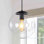 Luminaire suspendu moderne avec globe réglable en verre pour espaces de vie contemporains