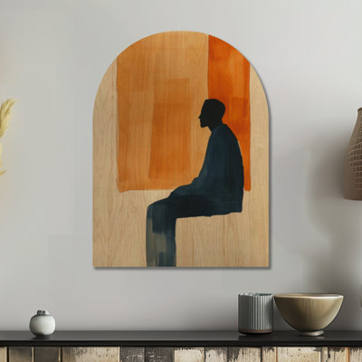 Réflexion silencieuse en position assise - Tableau mural en bois arqué avec silhouette orange