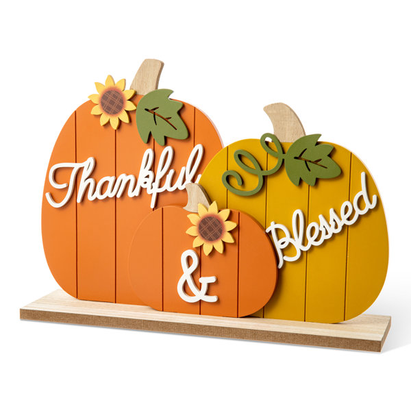 https://assets.wfcdn.com/im/10518431/resize-h600-w600%5Ecompr-r85/2429/242977342/16%22L+Thanksgiving+Wooden+Pumpkins+Table+Decor.jpg