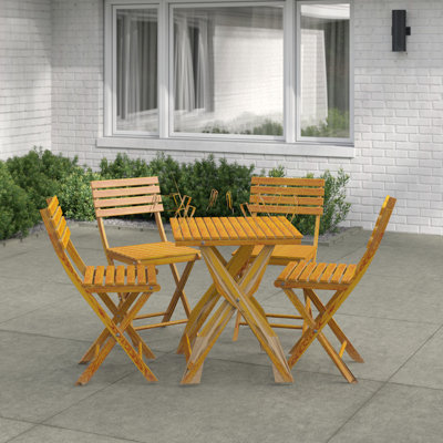 Alameda 4 - Person Acacia Solid Wood Patio Dining Set Rectangular Table with Cushions Included