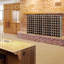 Kurti 40 Bottle Solid Wood Floor Wine Bottle & Glass Rack in Brown
