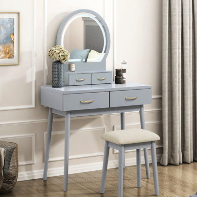 Coiffeuse de luxe pour chambre à coucher avec finition grise, miroir DEL, 4 tiroirs et tabouret rembourré pour présenter les cosmétiques. Tabouret assorti, en bois.