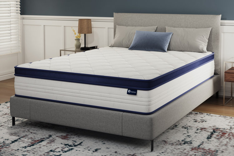gray upholstered bed with hybrid mattress