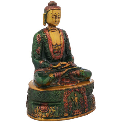 Bouddha Murugun assis sur un piédestal haut