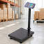 Balance numérique au sol de 300 kg (660 lb), précision de 0,05 kg (0,1 lb), acier noir, conversion lb/kg et calculateur de prix