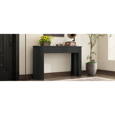 Console d'entrée avec des détails cannelés et un look élégant, finition noire, pour le côté, avec des pieds courbés de style colonne, un design moderne, 2 tiroirs organisant de petits objets de décoration, un plateau ovale, adapté