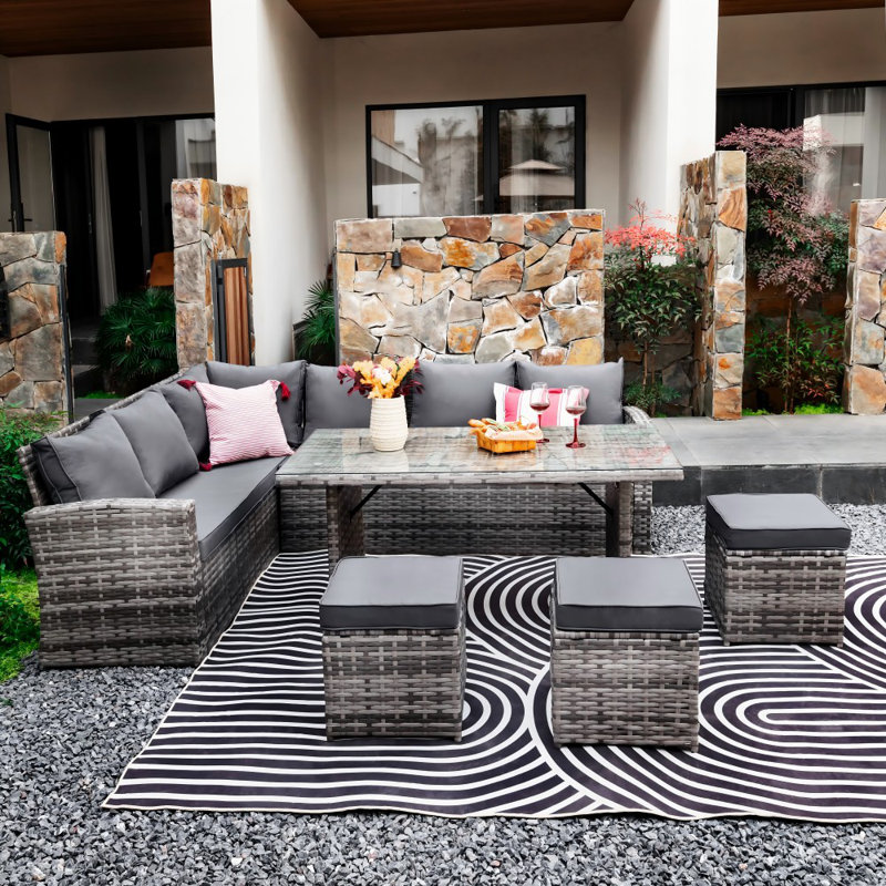 Philipston 9 - Person Wicker Patio Dining Set with Rectangular Table , Cushions Included