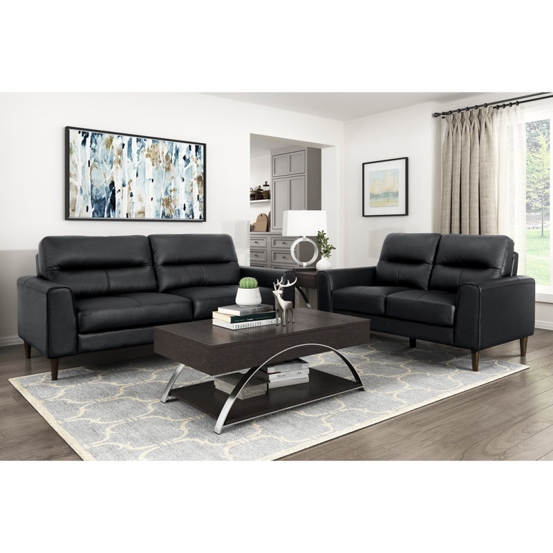 Cuir noir avec coussins en mousse à haute densité, structure en bois massif, largeur de produit de 34,5 po, mousse de siège profilée et profondeur de siège en contreplaqué de 20,5 po, lignes rétro
