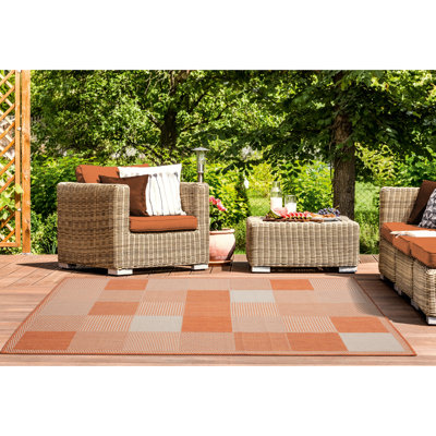 Tapis terre cuite à motif géométrique Faro