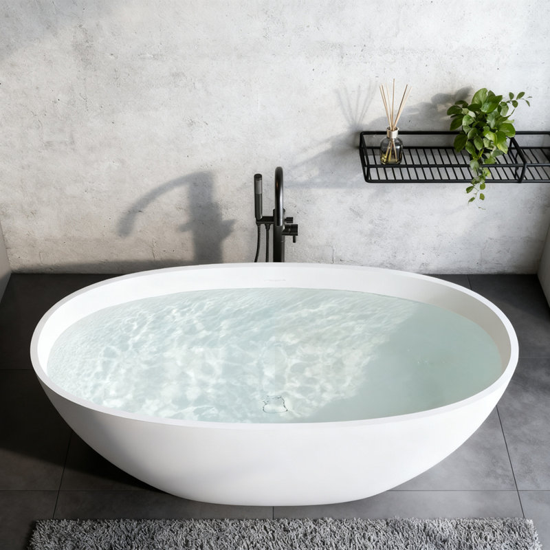 Baignoire de trempage autoportante à surface solide avec trop-plein et bonde escamotable, durable et élégante pour les salles de bain modernes.