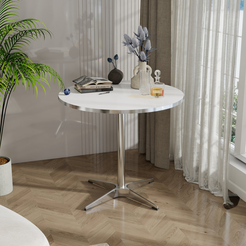 Petite table à manger ronde moderne de style minimaliste convenant à un salon de cuisine