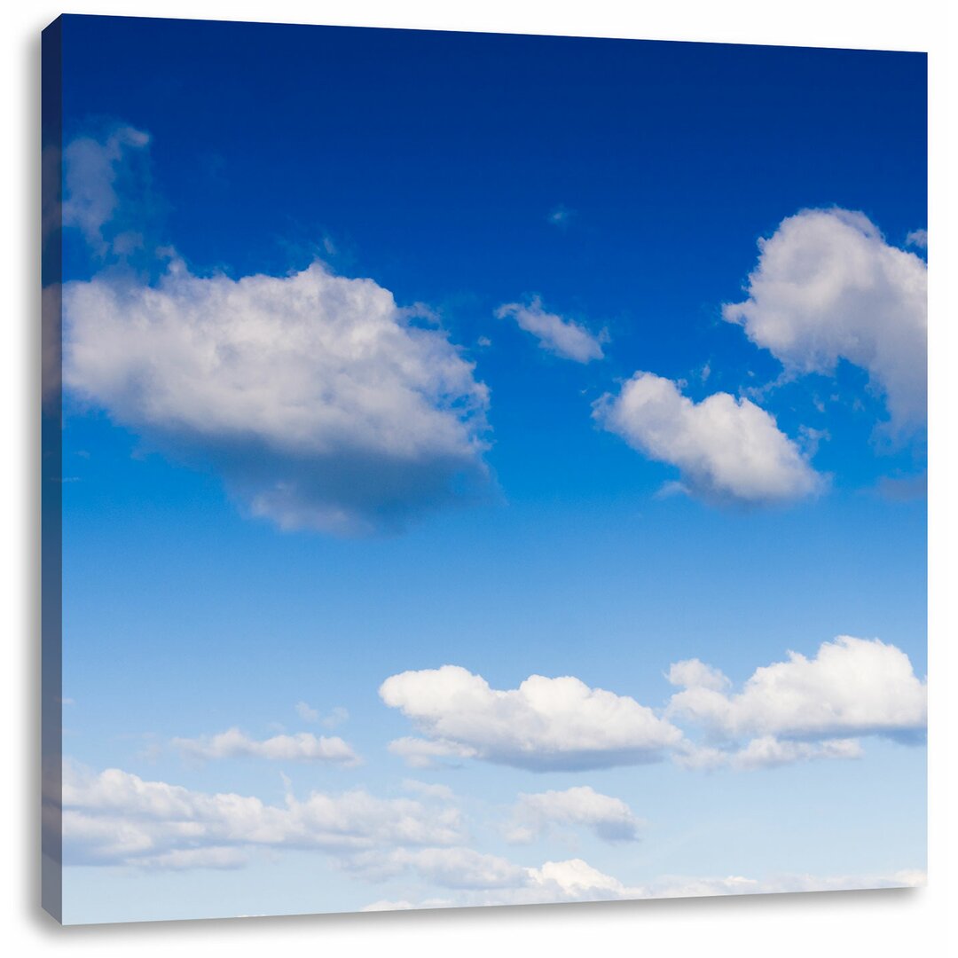 Leinwandbild Wolken am blauen Himmel