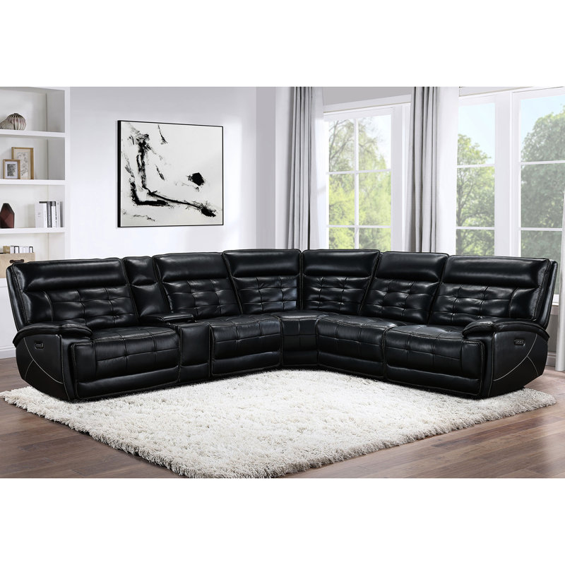 Canapé d'angle électrique double en cuir noir, avec surpiqûres contrastées et console de rangement pour recharger les appareils. Créez une ambiance lounge relaxante grâce à son siège inclinable en cuir pleine fleur noir. Un véritable cocon de confort.