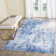 Tapis bleu / blanc à motif abstrait Mcelroy