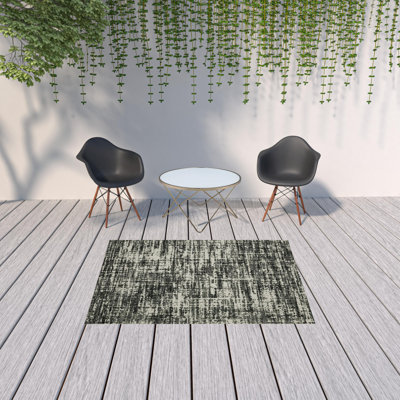 5' X 7' Beige And Black Abstract Stain Resistant Indoor Outdoor Area Rug