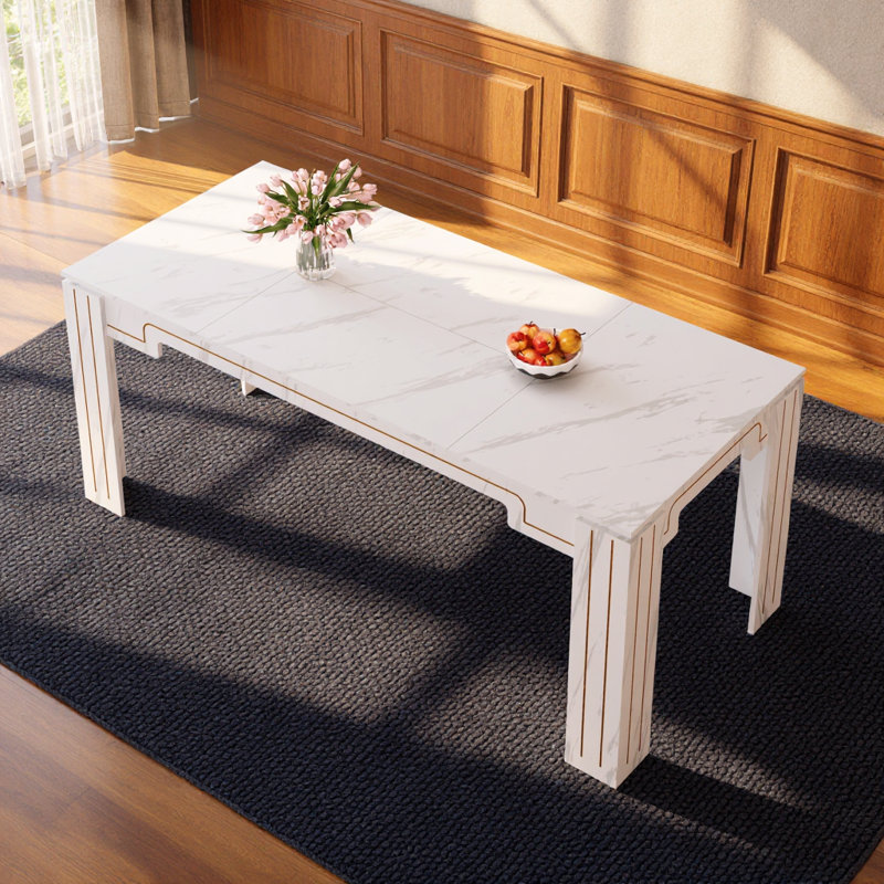 Table de salle à manger minimaliste en marbre blanc avec pieds rainurés pouvant accueillir de six à huit personnes