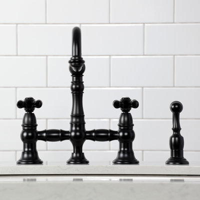 Kingston Brass Duchess Two-Handle 4-Hole Deck Mount Bridge Kitchen Faucet with Brass Side Sprayer
