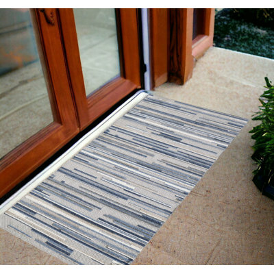 Tapis d'extérieur à rayures abstraites Gemmill