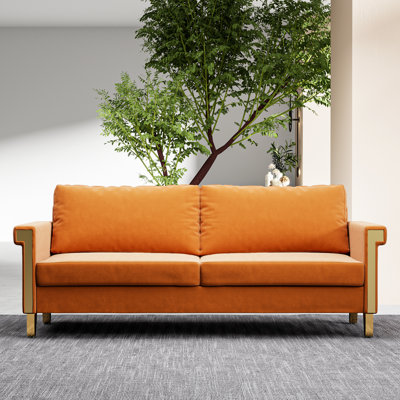 Lit de jour moderne en velours orange avec pieds en métal doré et coussins profonds pour le salon