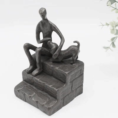 Figurine Dibiase homme caressant un chiot