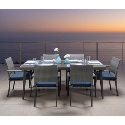 Ehrenfried Rectangular 6 - Person 78'' Long Wicker Dining Set with Sunbrella Cushions