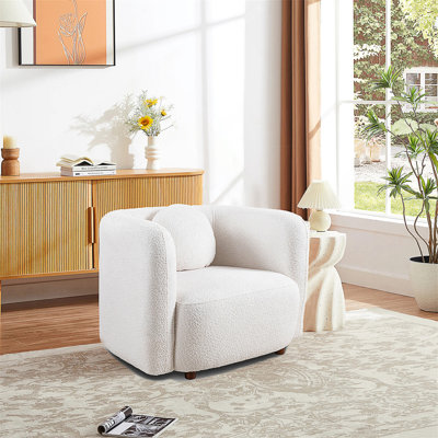 Canapé d'appoint minimaliste de style japonais avec un design ergonomique et un tissu bouclé confortable, parfait pour les espaces de vie modernes.