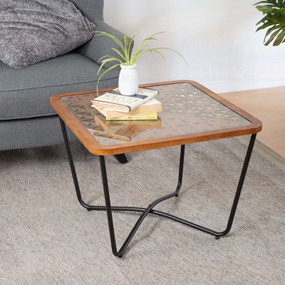 Table basse moderne carrée avec design industriel, plateau en verre trempé et structure en métal robuste pour une utilisation polyvalente