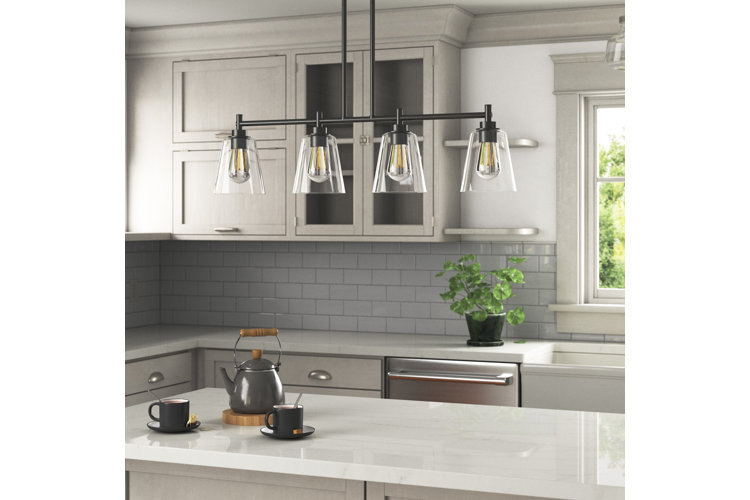 Kitchen island light with four glass shades and a black frame.
