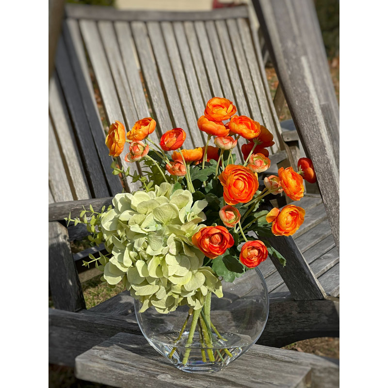 Ranunculus, Hydrangea and Eucalyptus Arranged in a Clear Glass Vase