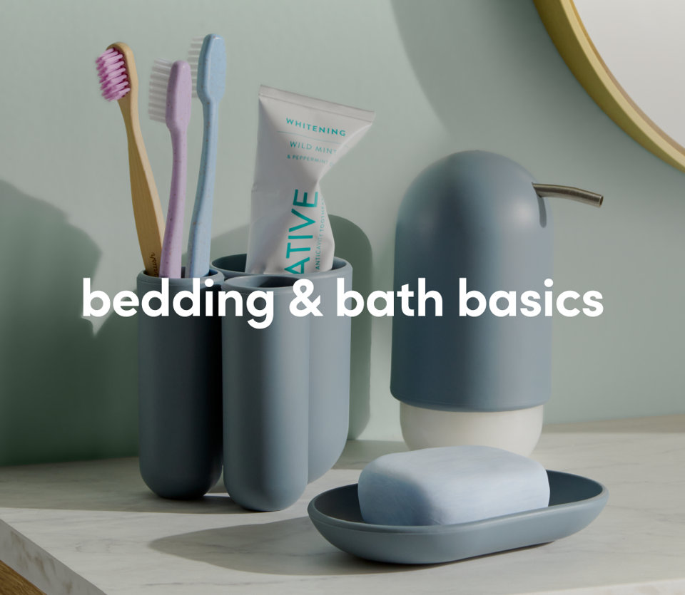 Bathroom essentials including towels, toiletry containers, and brushes neatly arranged.