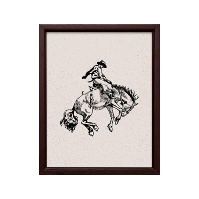 Cowboy chevauchant un cheval sauvage