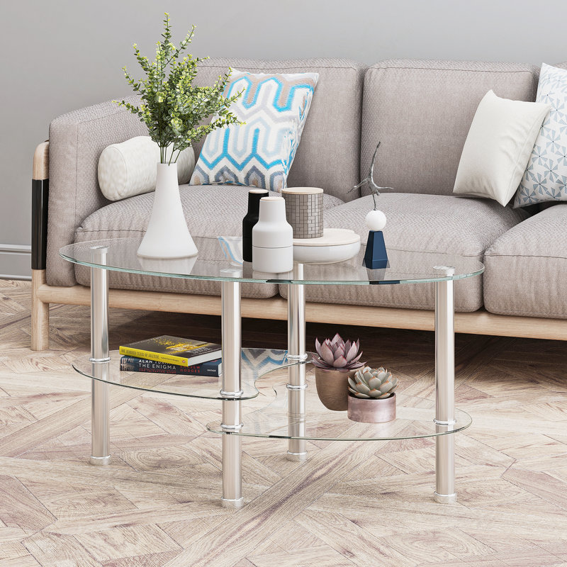 Table basse ovale avec plateau en verre et tablette