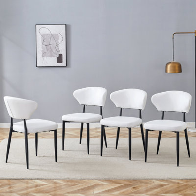 La chaise de salle à manger minimaliste et ergonomique, avec un dossier incurvé pour une conception confortable, libère une nouvelle position assise confortable et minimaliste. Un ensemble de 4 est disponible en noir et blanc.