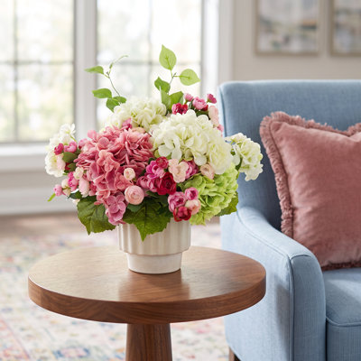 Hydrangeas and Ranunculus Arranged in Ceramic Pot