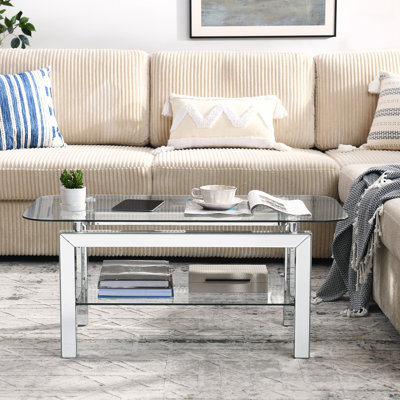 Table basse rectangulaire en verre avec pieds en miroir et rangement ovale élégant
