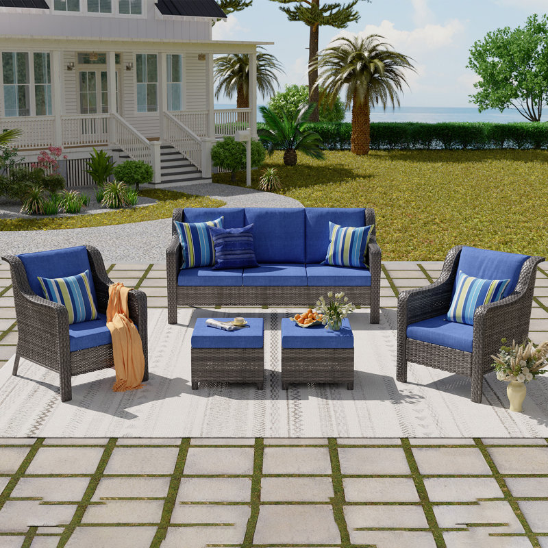 A Three-Seater Sofa + Two Armchairs + Two Footstools