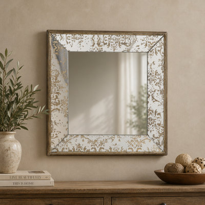 Miroir antique argenté avec détails floraux