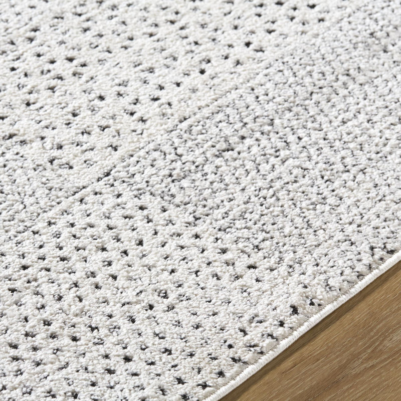 Livabliss 8' x 10' Ivory and Black Synthetic Patchwork Area Rug