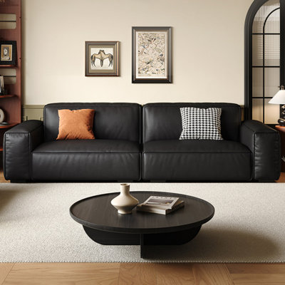Causeuse-coussin modulable noire en cuir véritable